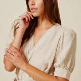 BEACHWOOD CANYON ruffle bottom wrap dress in naked - sand